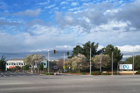 Entrance sign and grounds of the Meta Platforms headquarters complex, 1 Hacker Way, Menlo Park, California