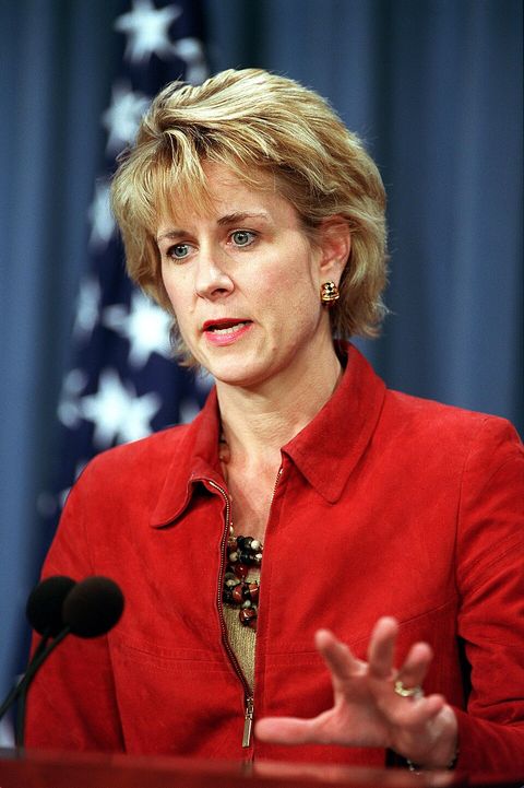 Assistant Secretary of Defense for Public Affairs Victoria Clarke at a Pentagon press briefing lectern in front of a flag, 2001