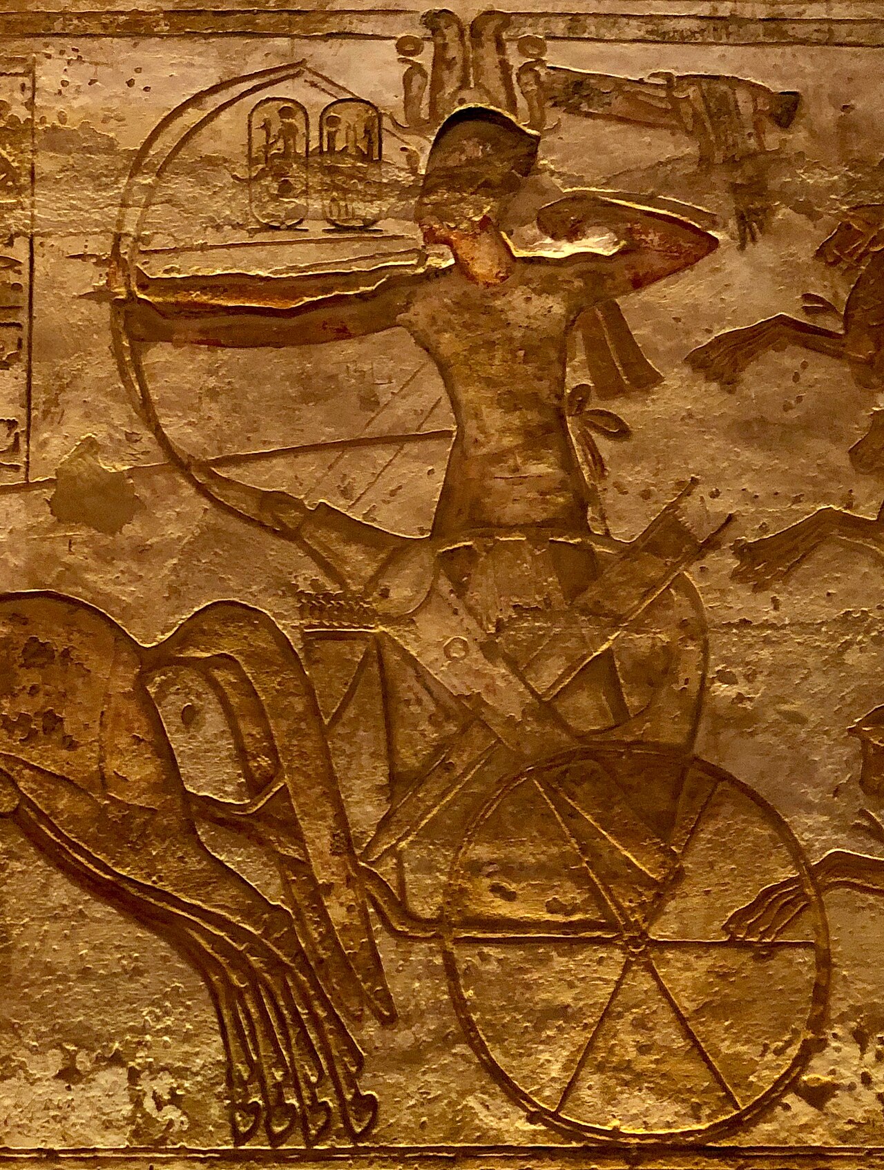 Relief at Abu Simbel: Ramesses II in his chariot draws a bow, his name in cartouches above him