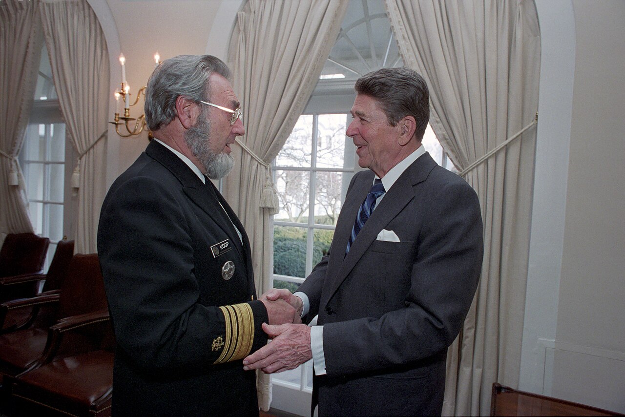 C. Everett Koop and Ronald Reagan shake hands at the White House, 22 January 1986