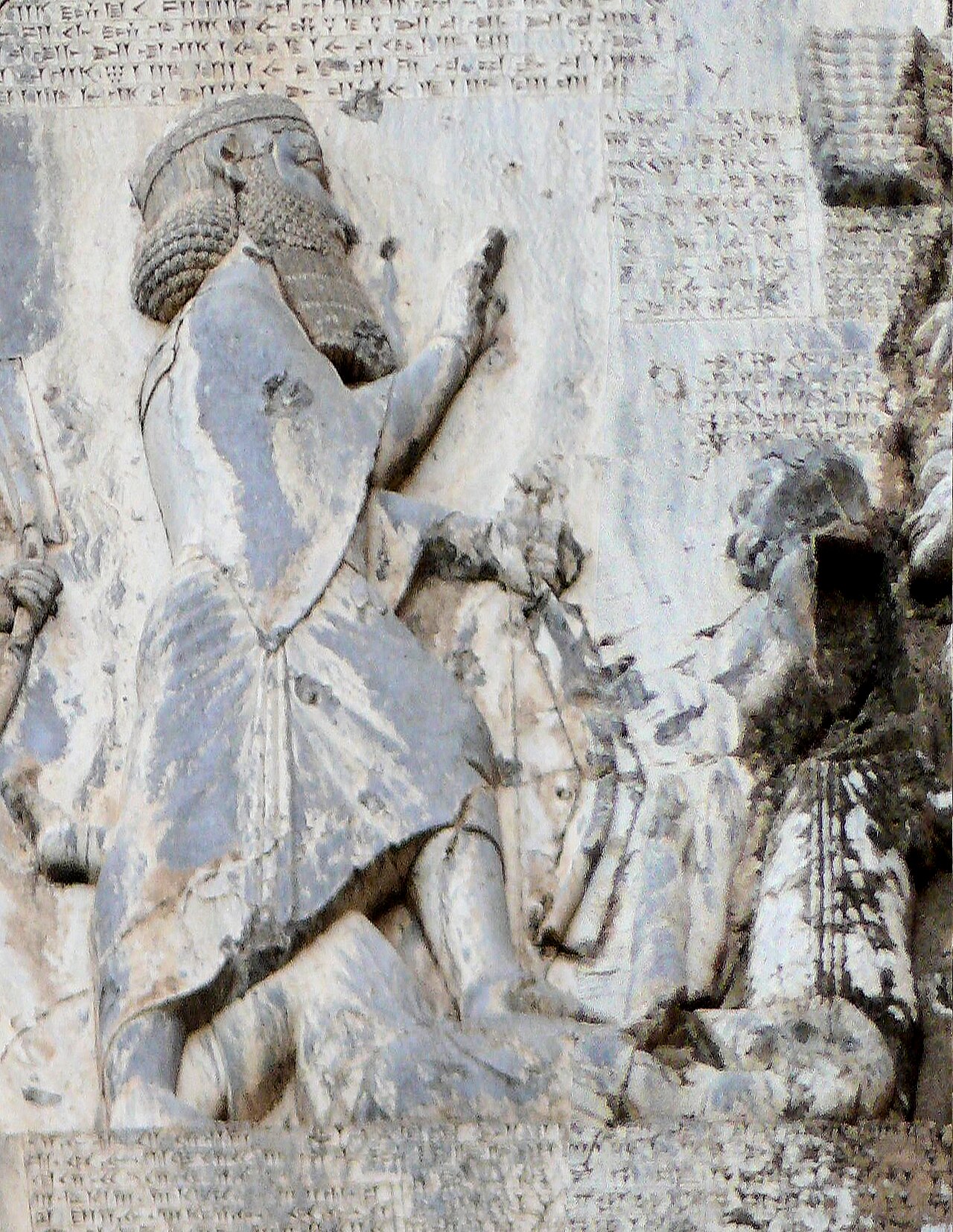 Detail of the Behistun relief: Darius raises his hand, his foot on the chest of a figure lying on its back with arms raised