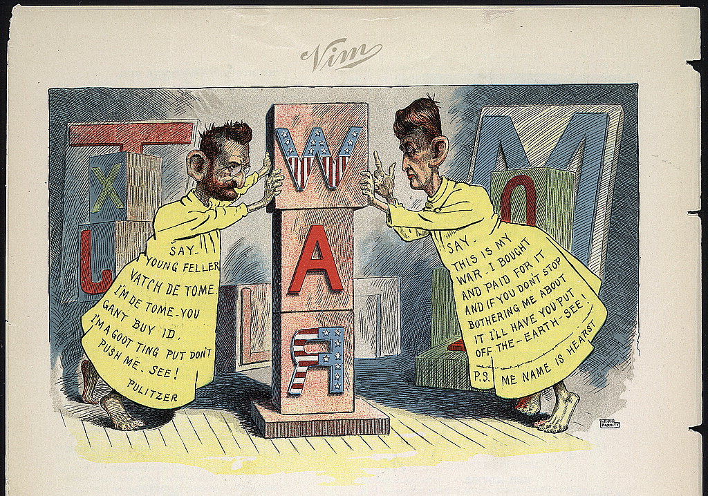 Cartoon: Pulitzer and Hearst dressed as the Yellow Kid pushing letter blocks spelling WAR