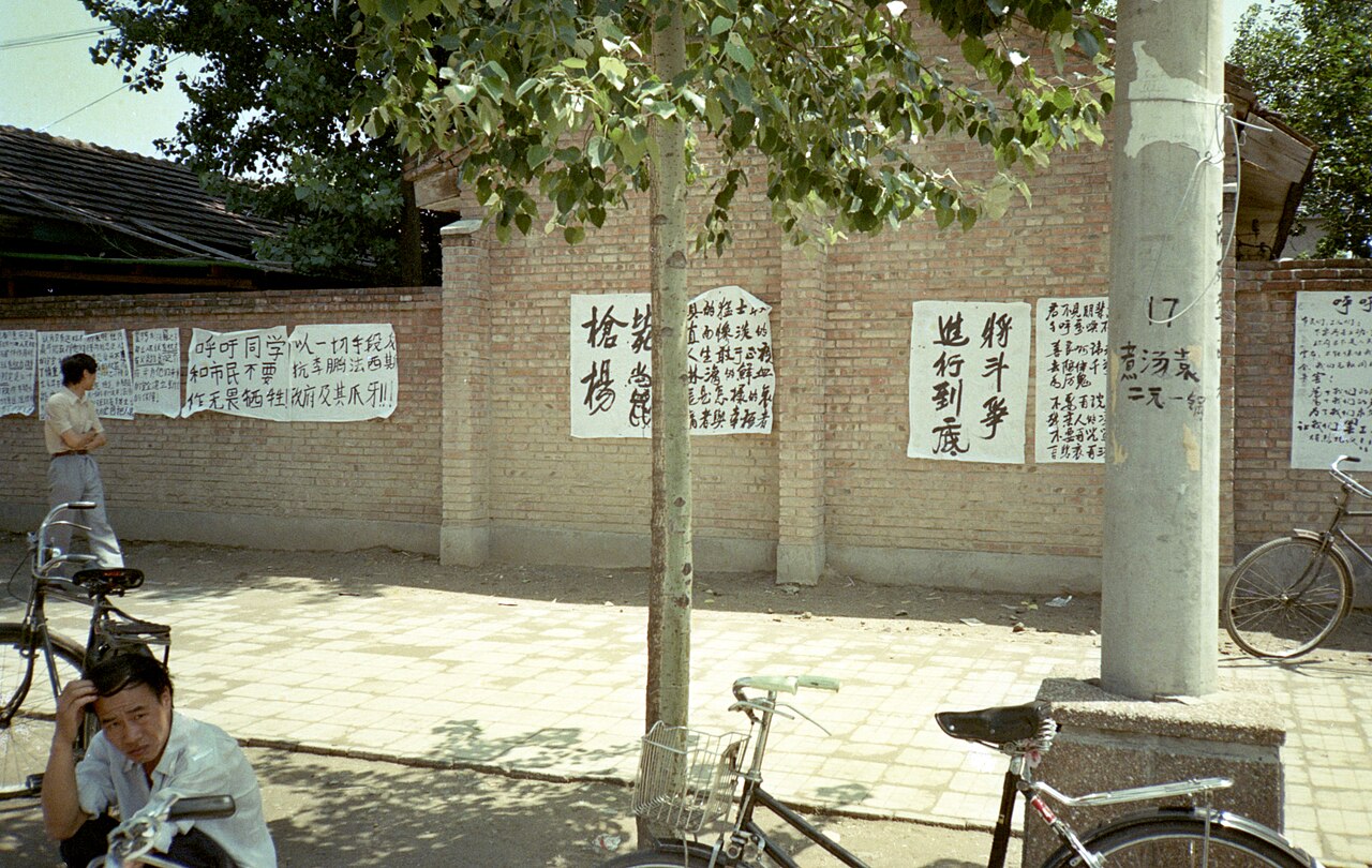 Hand-written posters pasted on a brick wall on Zhongguancun street, Beijing, June 1989