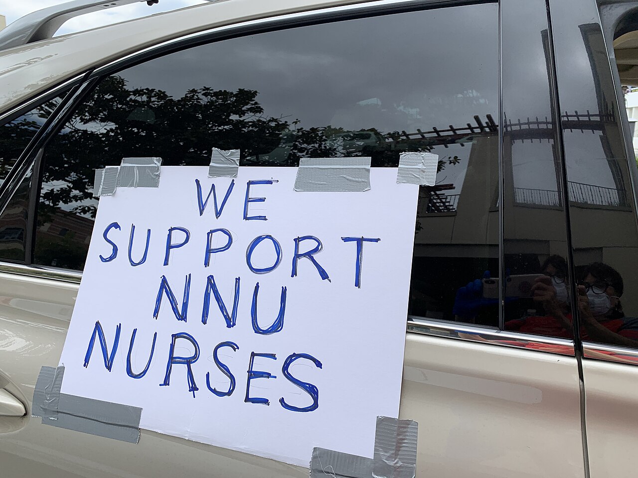 Hand-lettered "We support NNU nurses" sign on a car window, Los Angeles, April 2020
