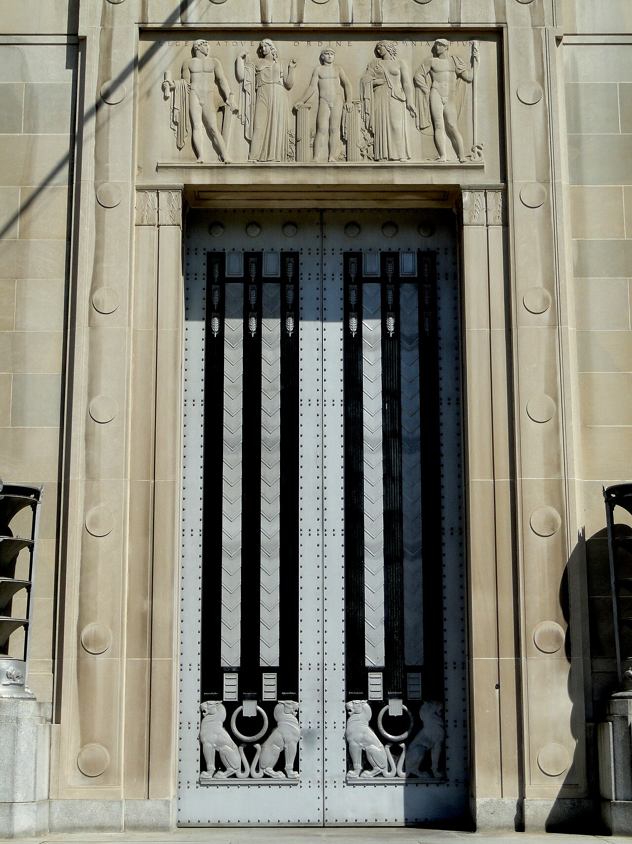 Doorway of the Robert F. Kennedy Department of Justice Building, Washington, D.C., with the relief inscribed "Lege Atque Ordine Omnia Fiunt"
