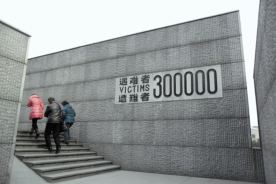 The wall reading 'Victims 300000' in Chinese, English and Japanese at the Nanjing Massacre Memorial Hall