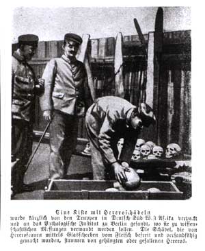 Photograph of soldiers packing Herero skulls into a crate, with a printed German caption