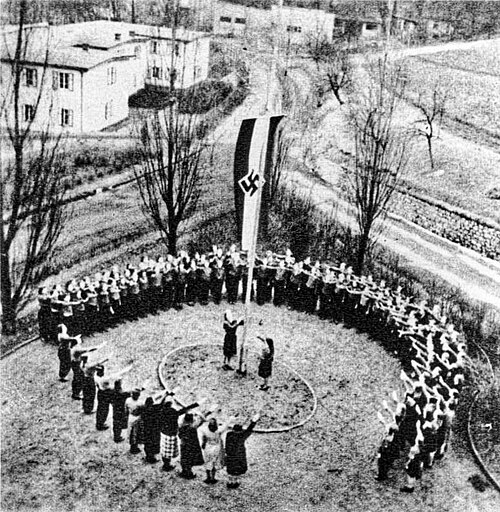 Girls of a KLV camp's "Lagermädelschaft" lined up for a flag roll call