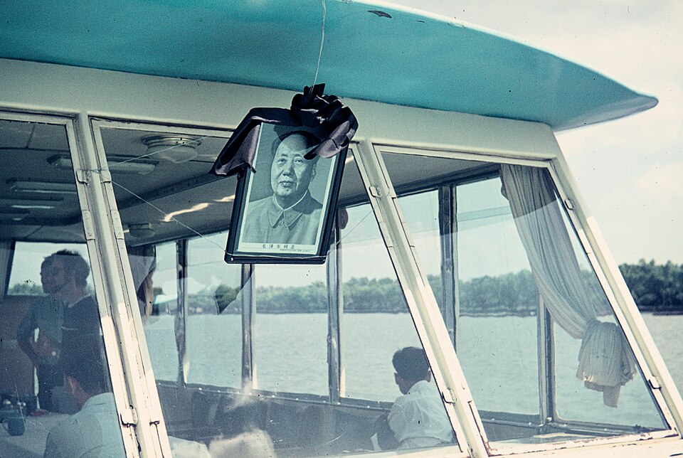 Portrait of Mao Zedong with a black mourning ribbon hung in the window of a tour boat on West Lake, Hangzhou, September 1976
