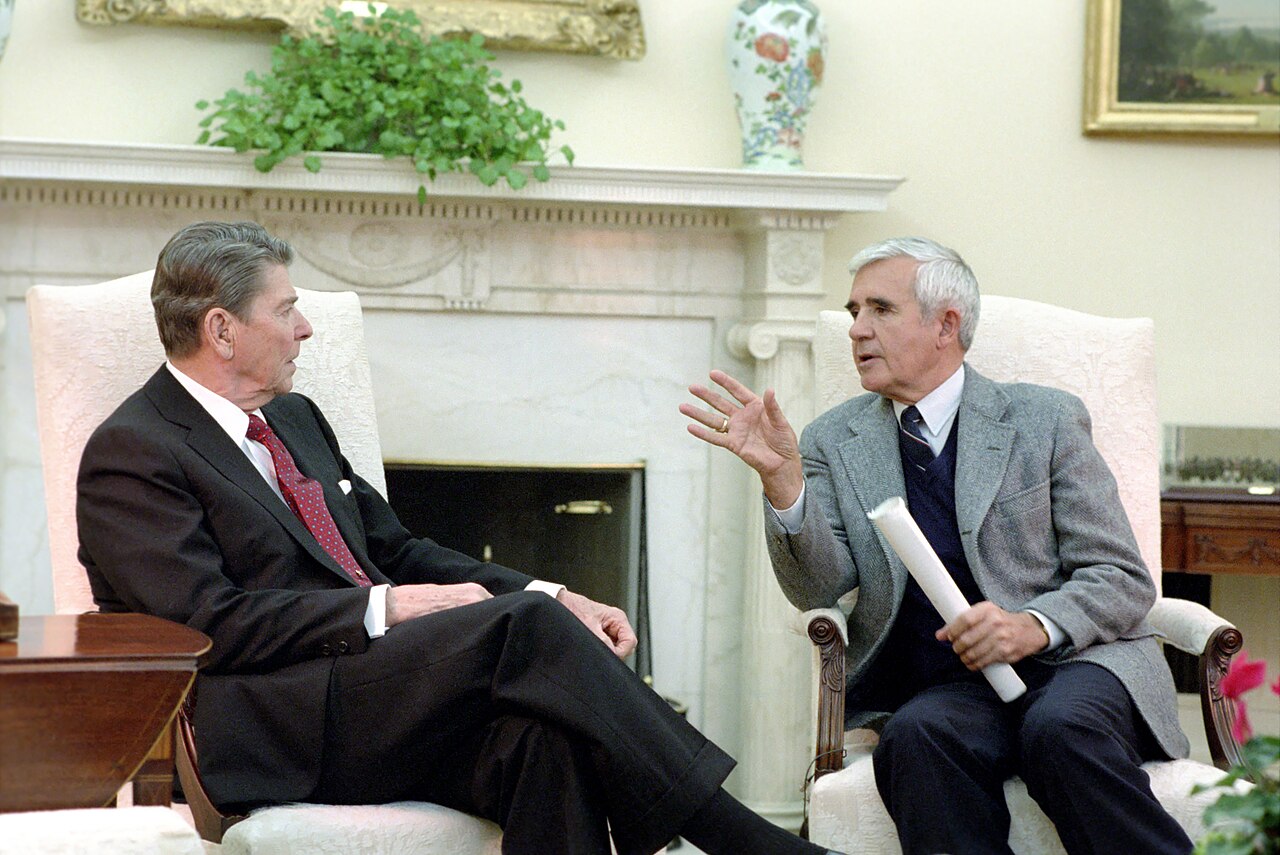 Reagan receives a briefing from Senator Paul Laxalt on the Philippines, Oval Office, 24 February 1986