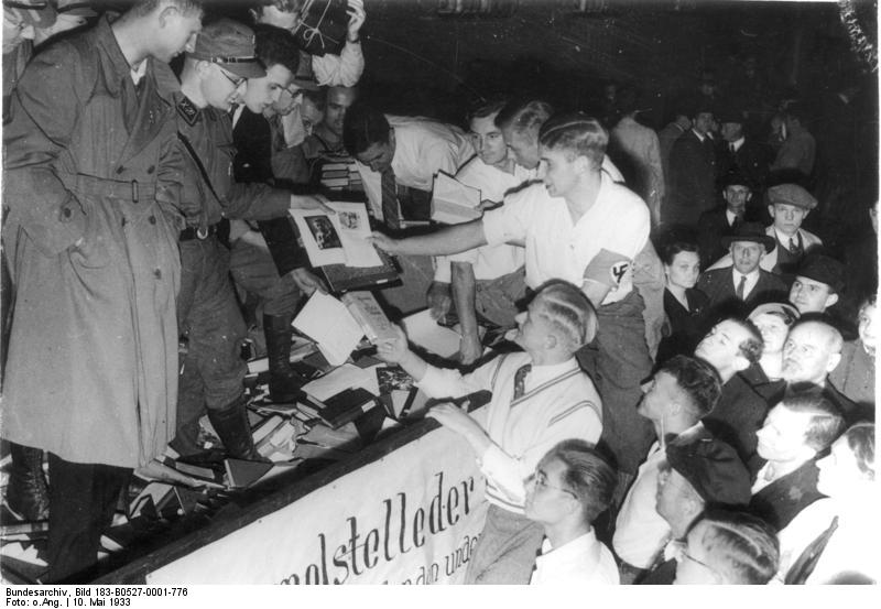 Students and SA men hand down confiscated books from a collection vehicle, Berlin, 10 May 1933
