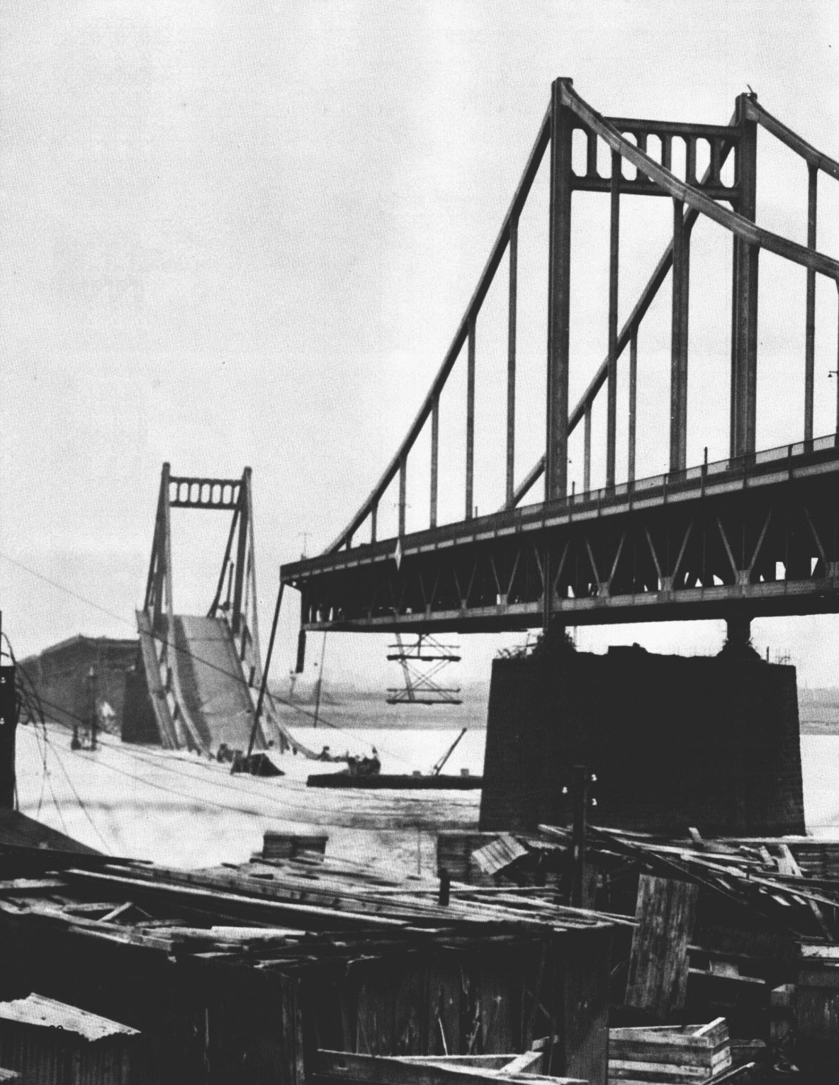 The Krefeld-Uerdingen Rhine road bridge, one span collapsed into the river and the other still standing, 1945