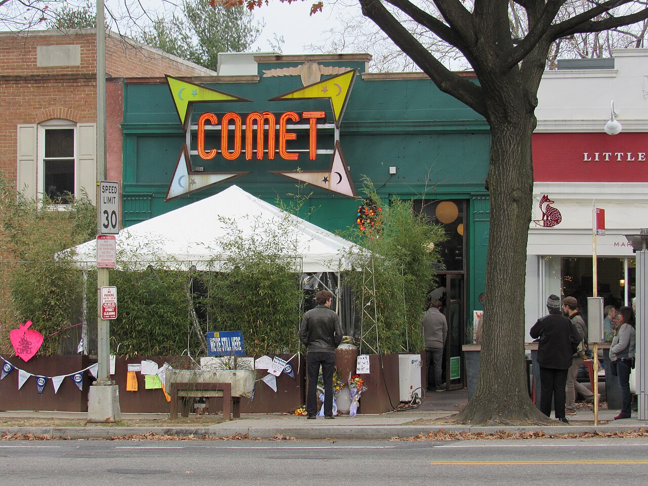 Comet Ping Pong, Washington, D.C., December 2016, with notes of support on the fence