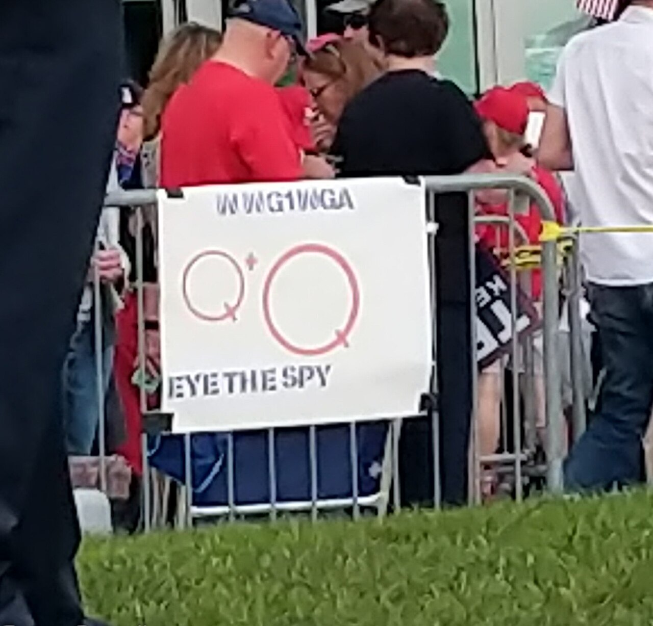 A "Q" sign reading WWG1WGA at a campaign rally, August 2019