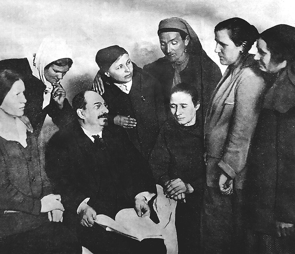Photograph of Anatoly Lunacharsky seated among a group of women, 1927