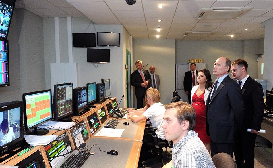 Vladimir Putin and RT staff in a control room at the new Russia Today broadcasting centre, Moscow, June 2013