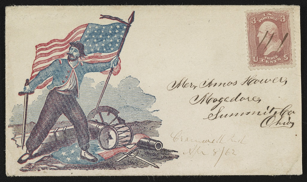Union envelope: a bearded soldier strides over a trampled Confederate flag, holding the Stars and Stripes and a sword, beside a broken drum and cannon; postmarked April 1862, addressed to Mogadore, Ohio