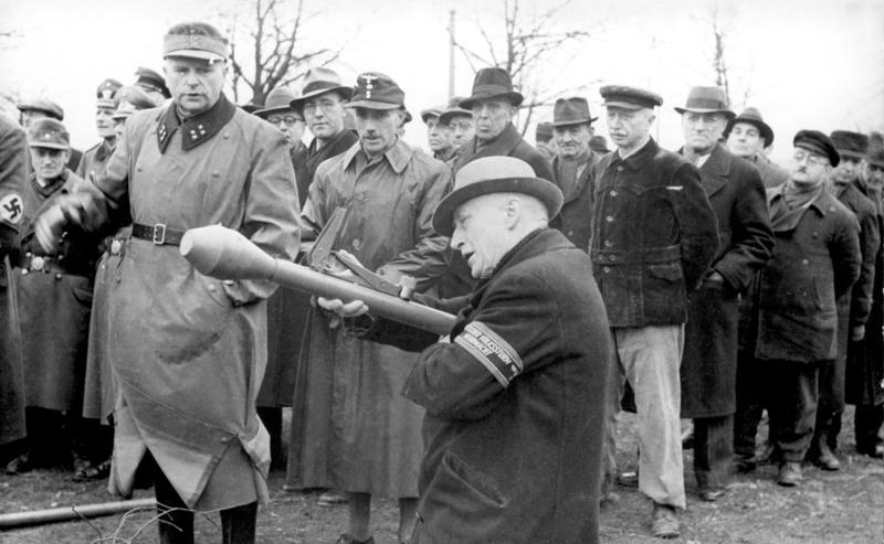 Volkssturm men drilling in Berlin, spring 1945, in civilian clothes with a mix of rifles