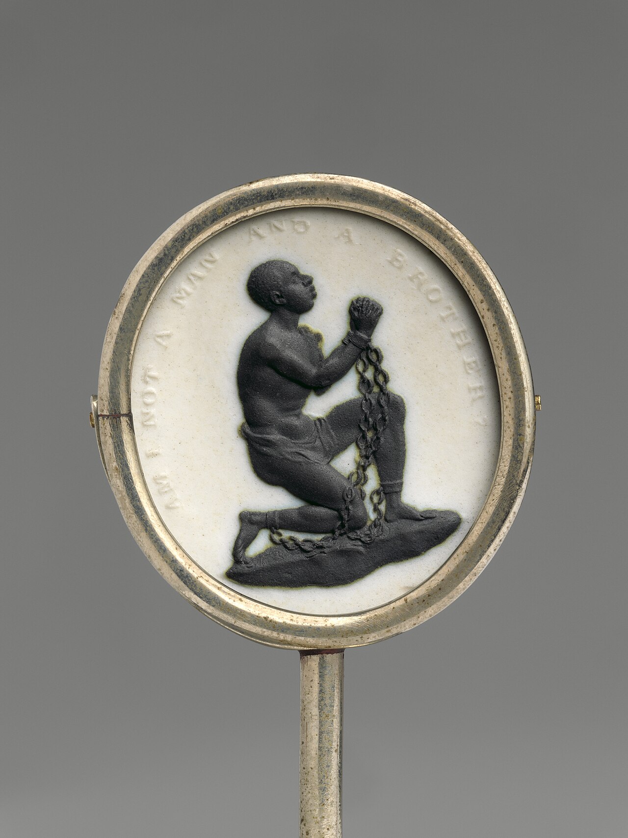 Wedgwood jasperware medallion: a kneeling, chained African man with raised clasped hands, inscribed "Am I not a man and a brother?"