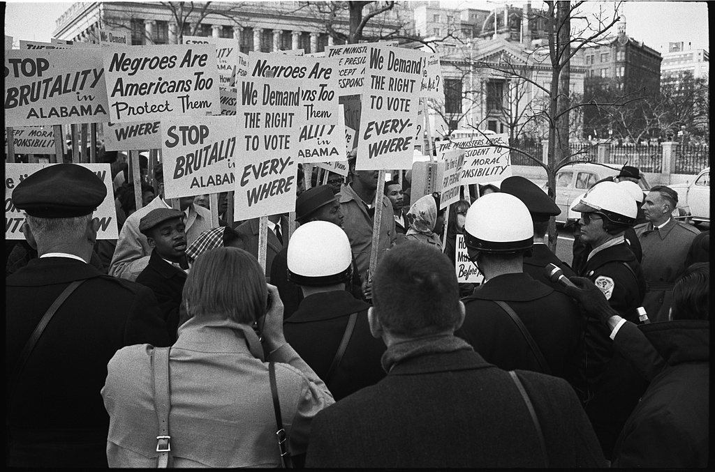 Demonstrators outside the White House with signs protesting police brutality in Selma, 1965