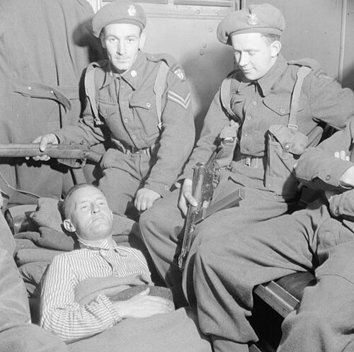 William Joyce lying wounded in an ambulance after his arrest, May 1945