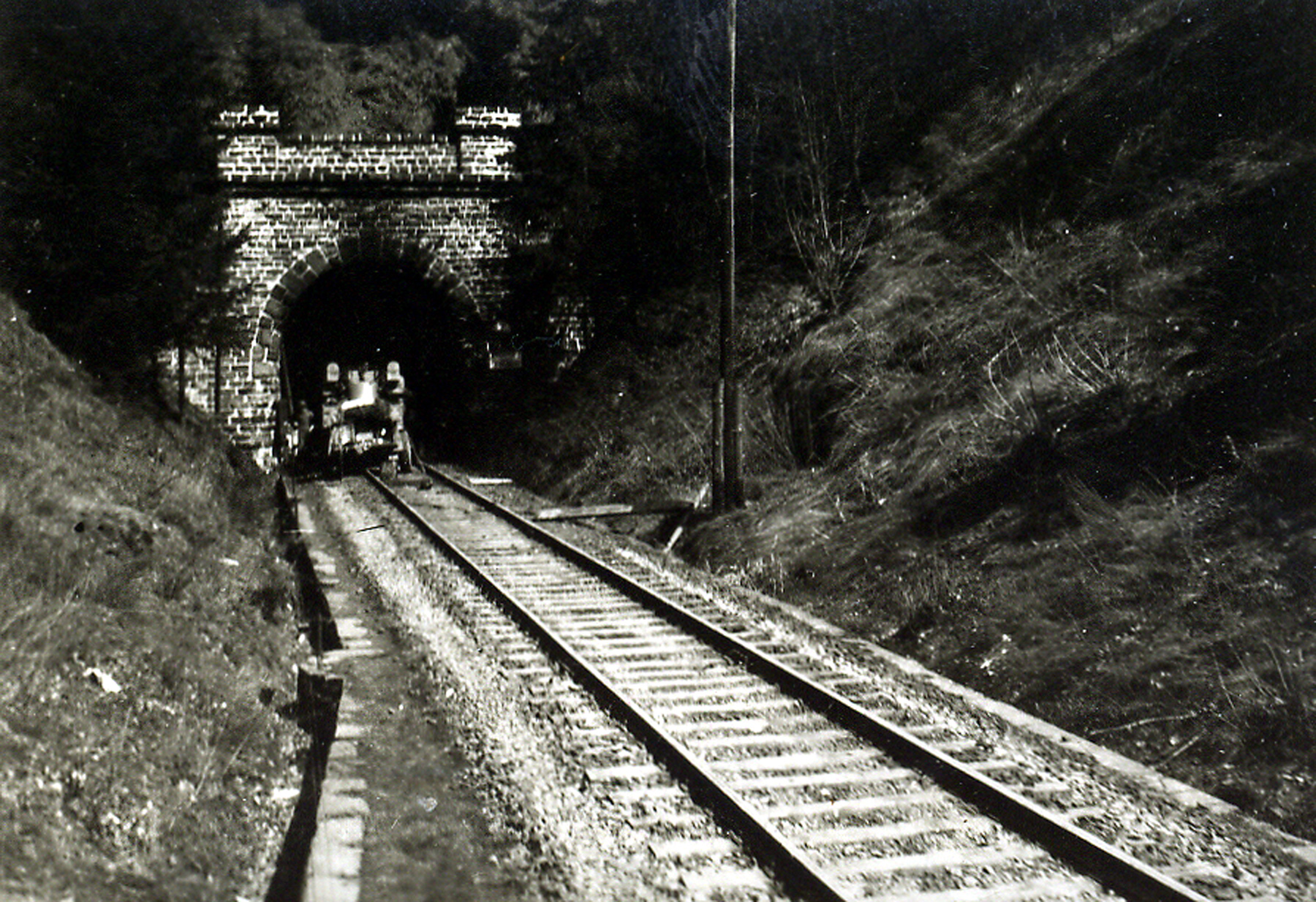 A tunnel entrance to a storage area for V-1 and V-2 rocket components at the Mittelwerk complex near Nordhausen, photographed after the plant's capture