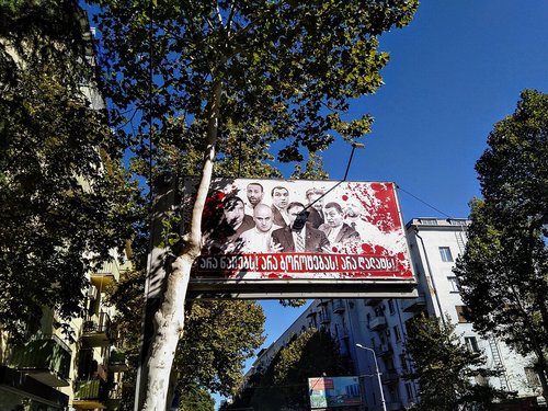 Billboard 'No to the Natsebi! No to evil! No to betrayal!' with blood-spattered portraits of opposition figures (Tbilisi, 27 September 2021)