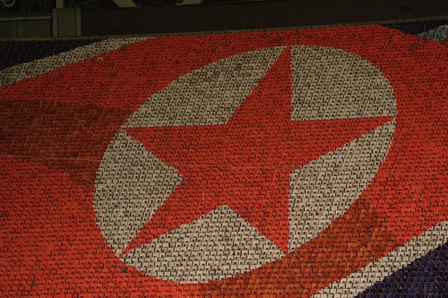 Arirang Mass Games: national flag formed by card-holding performers, Pyongyang (photographed 2007)