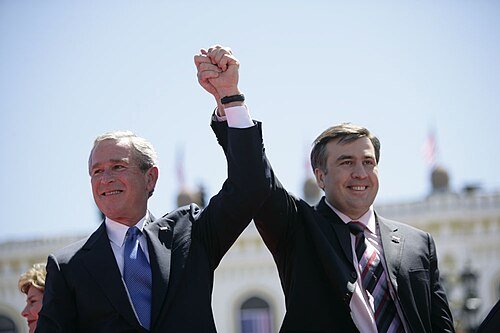 President Bush and President Saakashvili raise joined hands before the crowd, Freedom Square (Tbilisi, 10 May 2005)