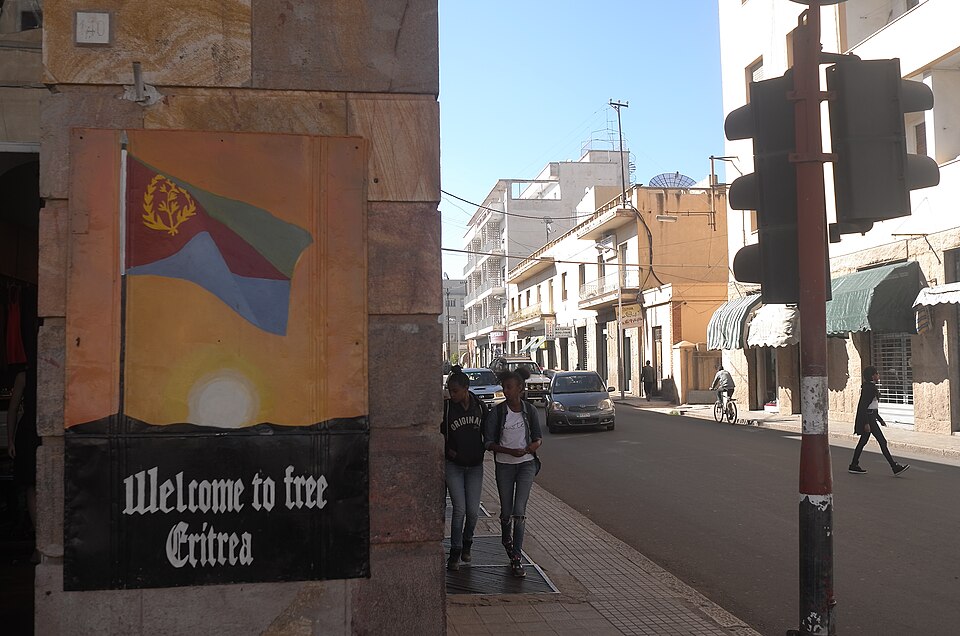 Welcome to free Eritrea: painted flag sign on a street corner in Asmara