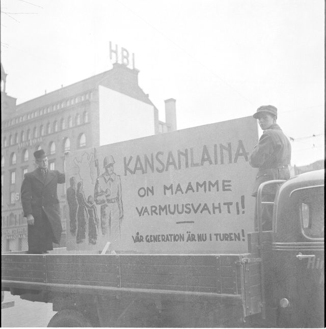 Kansanlaina on maamme varmuusvahti! (The People's Loan Is Our Country's Safeguard!): Finnish loan board on a truck