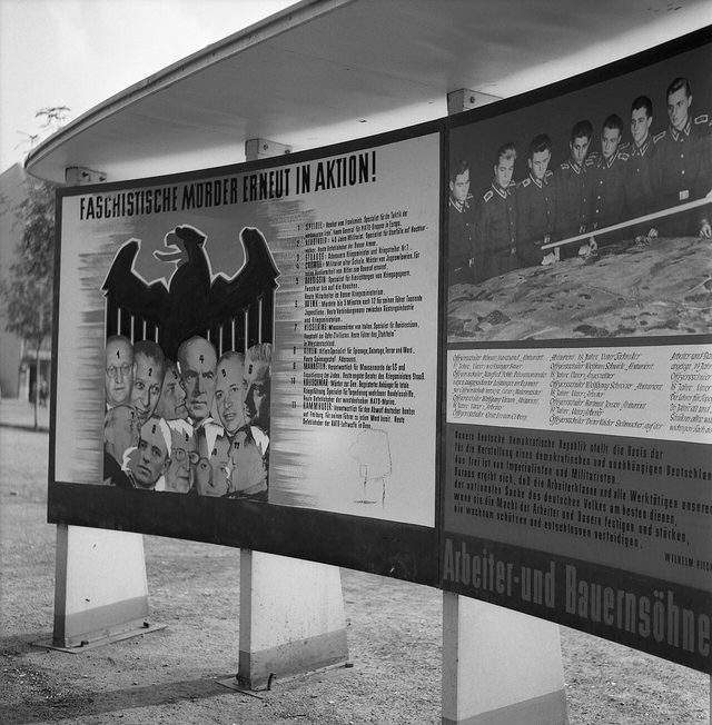 "Faschistische Mörder erneut in Aktion!": street board with eleven numbered portraits, East Berlin