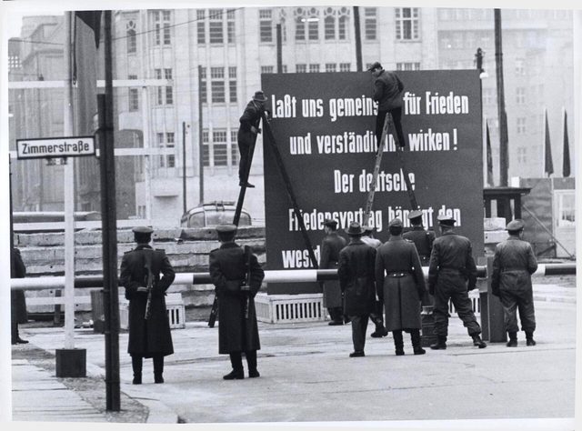 "Laßt uns gemeinsam für Frieden und Verständigung wirken!": GDR peace-treaty billboard at the Friedrichstraße crossing (CIA photograph)