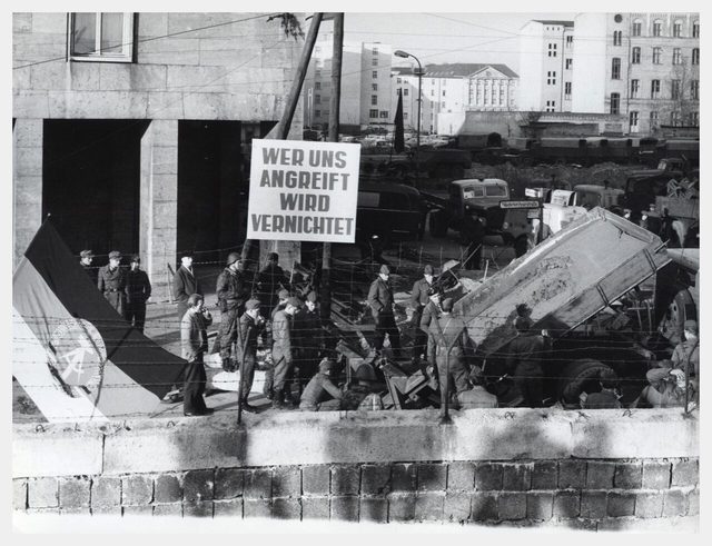 "Wer uns angreift wird vernichtet": GDR border sign beside the new Berlin Wall (CIA photograph)