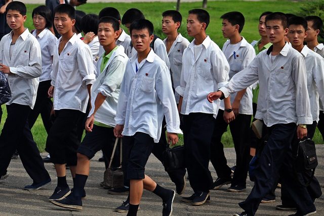 Kim Il-sung lapel badges on a school group, North Korea (photographed 2010)