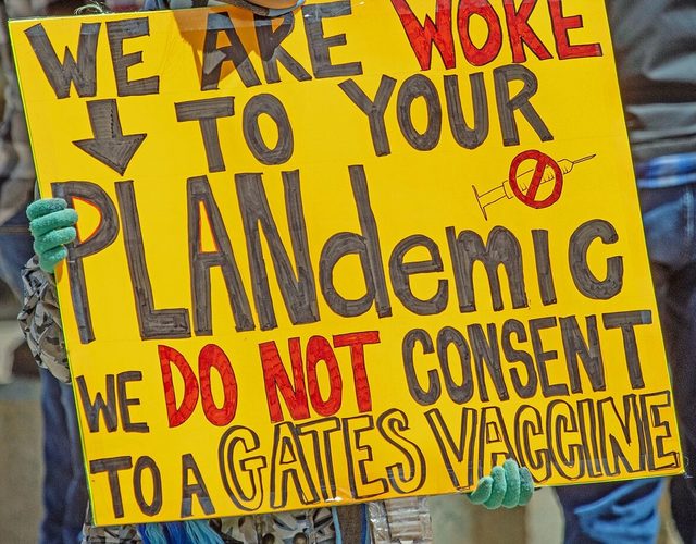 "We are woke to your PLANdemic" placard, Columbus, Ohio