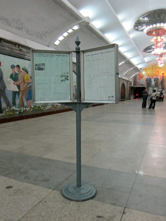 Rodong Sinmun public reading stand on a Pyongyang Metro platform (photographed 2012)