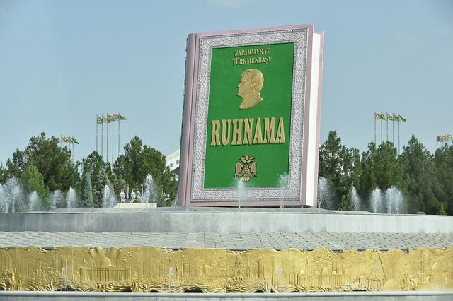 Ruhnama monument in Independence Park, Ashgabat: a giant model of the book with the portrait of Saparmurat Niyazov