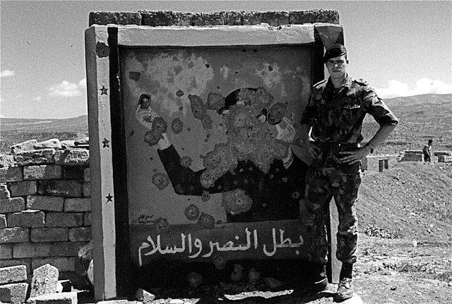 بطل النصر والسلام (Hero of Victory and Peace), Saddam Hussein roadside mural, bullet-damaged
