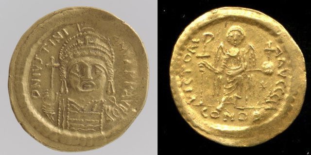 Gold solidus of Justinian I, reverse VICTORIA AVGGG with Victory holding a Christogram staff