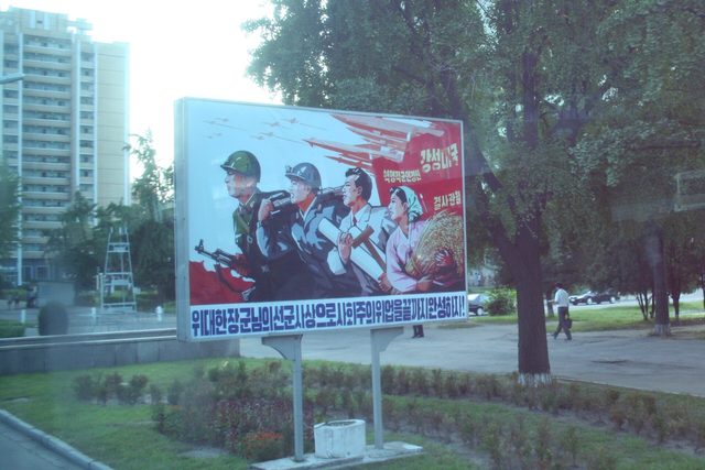 "위대한 장군님의 선군사상으로 사회주의위업을 끝까지 완성하자!": Songun billboard, Pyongyang (photographed 2011)