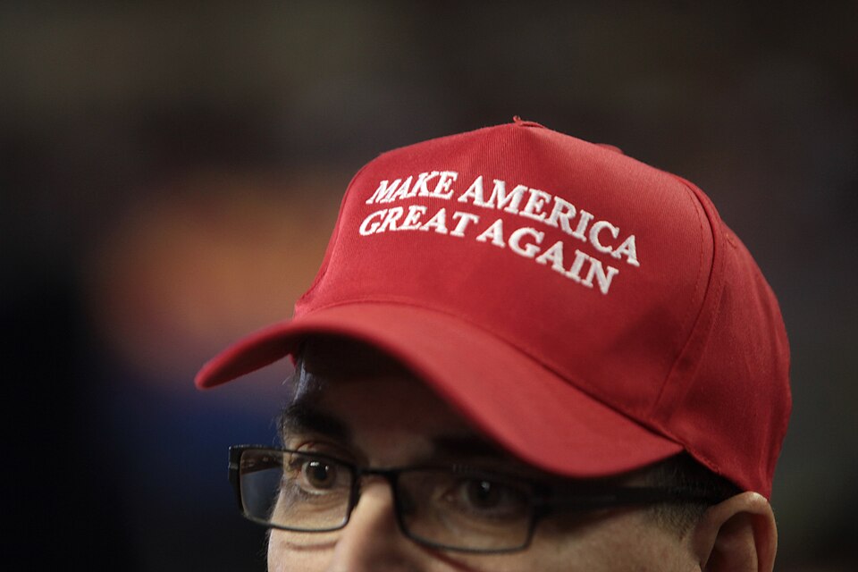 Red Make America Great Again cap worn at a Trump campaign rally in Phoenix