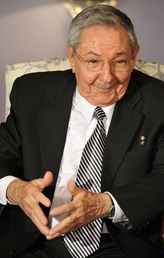 Raúl Castro in a dark suit, seated and gesturing, at a meeting in Moscow on 11 July 2012