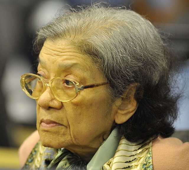 Ieng Thirith, an elderly woman with grey hair and glasses, seen in profile in a courtroom in 2011