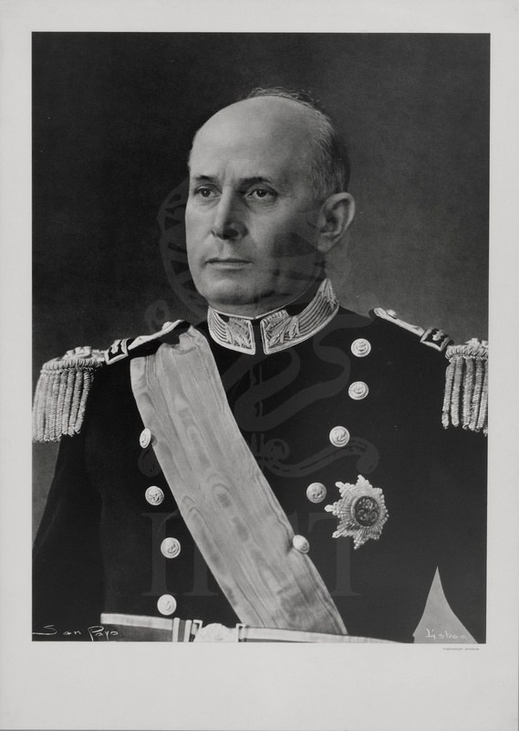 Almirante Américo Tomás in naval dress uniform with a sash, in a black and white portrait print