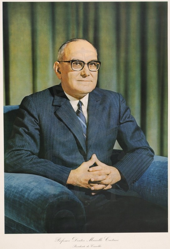 Marcelo Caetano seated in an armchair in a colour portrait print captioned Professor Doutor Marcello Caetano, Presidente do Conselho
