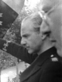 Ramón Serrano Suñer saluting from a balcony in Barcelona on 14 June 1939