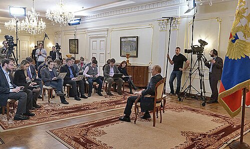 President Putin seated facing journalists at Novo-Ogaryovo, 4 March 2014